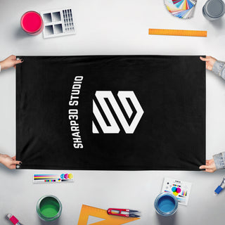 A mockup of the custom flag 'Sharp3d flag' held up on a table during print checking