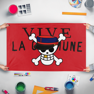 A mockup of the custom flag 'GEN Z COMMUNE flag' held up on a table during print checking