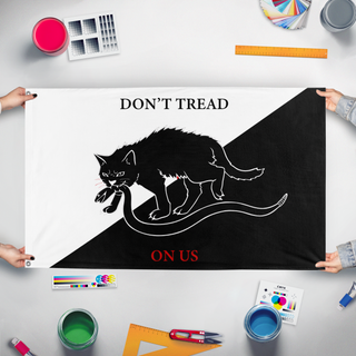 A mockup of the custom flag 'Anarchist Cat flag' held up on a table during print checking