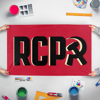 A mockup of the custom flag 'RCP Black on Tan flag' held up on a table during print checking