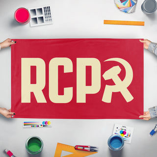 A mockup of the custom flag 'RCP Tan Flag' held up on a table during print checking