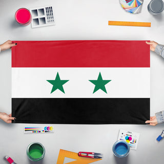A mockup of the custom flag 'Ba'athist Syria' held up on a table during print checking