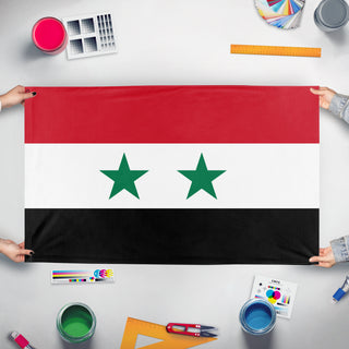 A mockup of the custom flag 'ba'athist syria' held up on a table during print checking