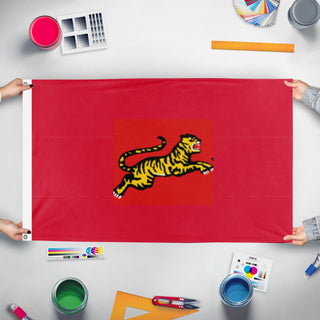 A mockup of the custom flag 'BIRU EMPIRE flag' held up on a table during print checking