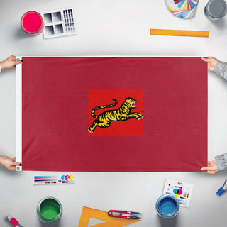 A mockup of the custom flag 'B EMPIRE flag' held up on a table during print checking