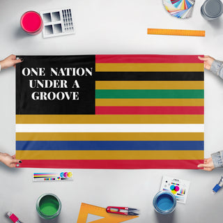 A mockup of the custom flag '1 Nation Under A Groove flag' held up on a table during print checking