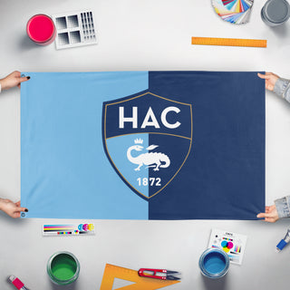 A mockup of the custom flag 'HAC Flag Request' held up on a table during print checking