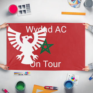 A mockup of the custom flag 'wydad flag' held up on a table during print checking