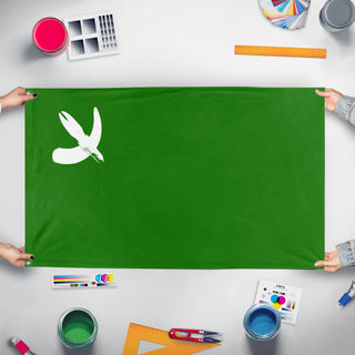 A mockup of the custom flag 'Hoof and Horn flag' held up on a table during print checking