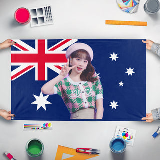 A mockup of the custom flag 'CHAEWON flag' held up on a table during print checking