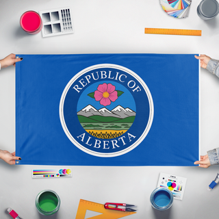 A mockup of the custom flag 'Alberta Republic  flag' held up on a table during print checking