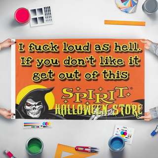 A mockup of the custom flag 'SpiritHalloween flag' held up on a table during print checking