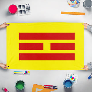 A mockup of the custom flag 'Empire of Vietnam flag' held up on a table during print checking
