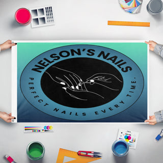 A mockup of the custom flag 'Nelsons nails  flag' held up on a table during print checking