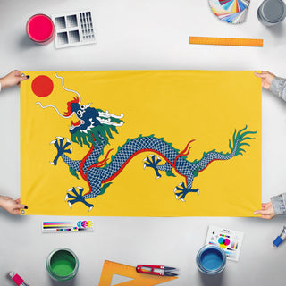 A mockup of the custom flag 'Qing  flag' held up on a table during print checking