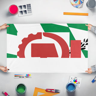 A mockup of the custom flag 'T flag' held up on a table during print checking