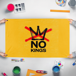 A mockup of the custom flag 'No Kings Flag' held up on a table during print checking