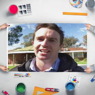 A mockup of the custom flag 'Christopher Sandia flag' held up on a table during print checking