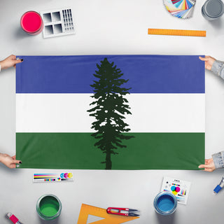 A mockup of the custom flag 'Doug flag' held up on a table during print checking
