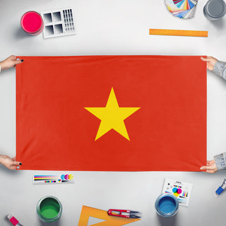 A mockup of the custom flag 'Vitnam flag' held up on a table during print checking