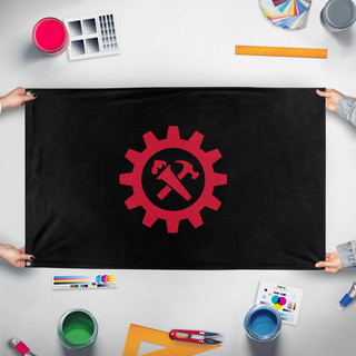 A mockup of the custom flag 'Torch and hammer flag' held up on a table during print checking