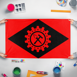 A mockup of the custom flag 'Anarcho-Syndicalist Brazil flag' held up on a table during print checking