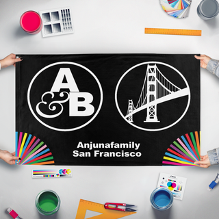 A mockup of the custom flag 'A&B SF  flag' held up on a table during print checking