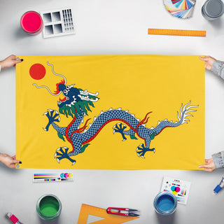 A mockup of the custom flag 'Qing Empire Flag' held up on a table during print checking