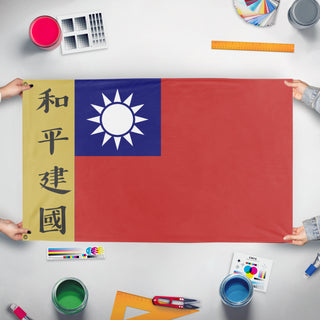 A mockup of the custom flag 'Kuomintang Battle flag' held up on a table during print checking