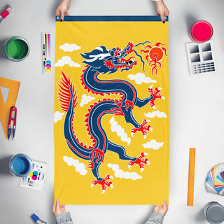 A mockup of the custom flag 'Vertical Qing Dragon Banner flag' held up on a table during print checking