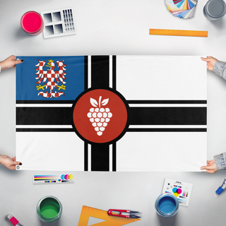 A mockup of the custom flag 'Moravian Imperium flag' held up on a table during print checking