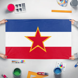 A mockup of the custom flag 'Flag of Socialist Yugoslavia' held up on a table during print checking