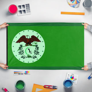 A mockup of the custom flag 'SAD flag' held up on a table during print checking