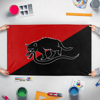 A mockup of the custom flag 'Anarcho-Syndicalist flag' held up on a table during print checking