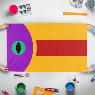 A mockup of the custom flag 'Verzzi Royal Flag' held up on a table during print checking