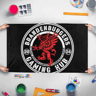 A mockup of the custom flag 'bkg flag' held up on a table during print checking