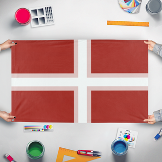 A mockup of the custom flag 'Cameria flag' held up on a table during print checking