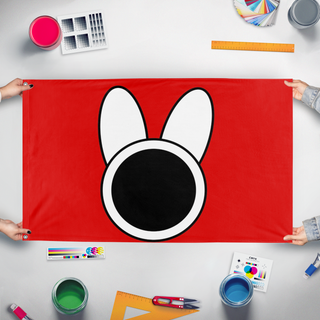 A mockup of the custom flag 'Flag of the new state of melonia' held up on a table during print checking