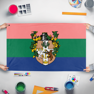 A mockup of the custom flag 'UFPI National Colors flag' held up on a table during print checking