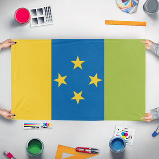 A mockup of the custom flag 'Nusia flag' held up on a table during print checking