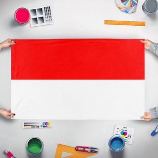 A mockup of the custom flag 'u89 flag' held up on a table during print checking