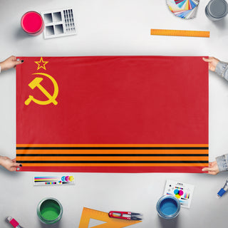 A mockup of the custom flag 'The Union of Soviet Federative Republics flag' held up on a table during print checking