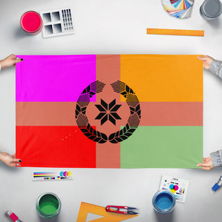 A mockup of the custom flag 'PMBI flag' held up on a table during print checking