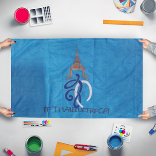 A mockup of the custom flag 'How to get  flag' held up on a table during print checking