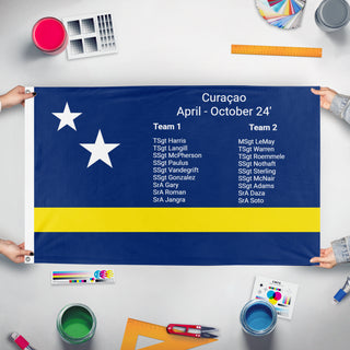 A mockup of the custom flag 'Curacao flag' held up on a table during print checking