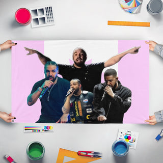 A mockup of the custom flag 'Drake flag' held up on a table during print checking