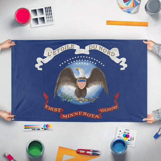 A mockup of the custom flag '1st Minnesota Volunteer Infantry Regiment flag' held up on a table during print checking