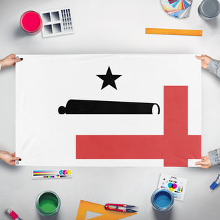 A mockup of the custom flag 'T flag' held up on a table during print checking