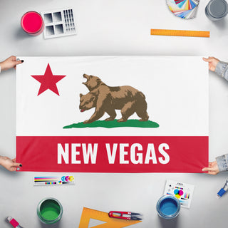 A mockup of the custom flag 'New Californian Vegas flag' held up on a table during print checking