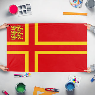 A mockup of the custom flag 'St Olaf with Three Leopards flag' held up on a table during print checking